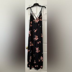 Black dress with floral design. Light material that can be worn in warm weather.